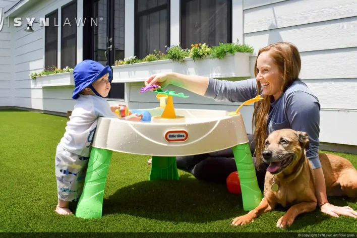 image of Mother and Toddler enjoying the outdoors on artificial grass